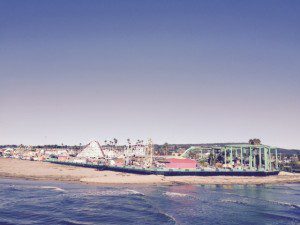 A beach with many boats in the water