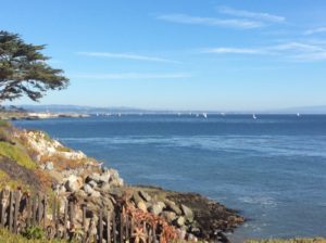 A view of the ocean from a rocky shore.