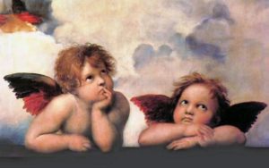 Two cherubs are sitting on a ledge.