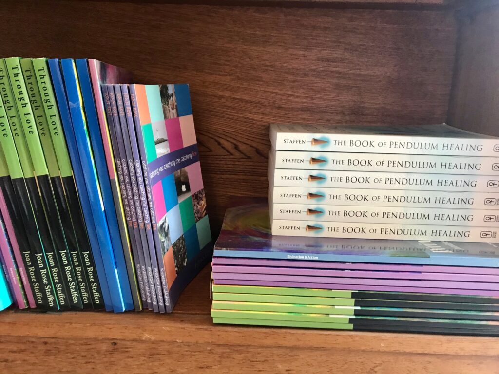 A shelf with books and cds on it